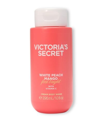 Victoria's Secret White Peach Mango Cream Body Wash 296 ml koralinis buteliukas su baltu dangteliu baltame fone